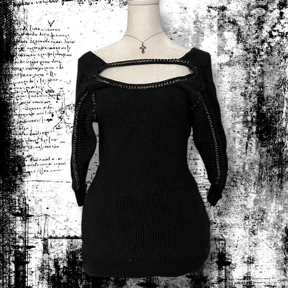 gold-chain neck trim framing washed black knit top